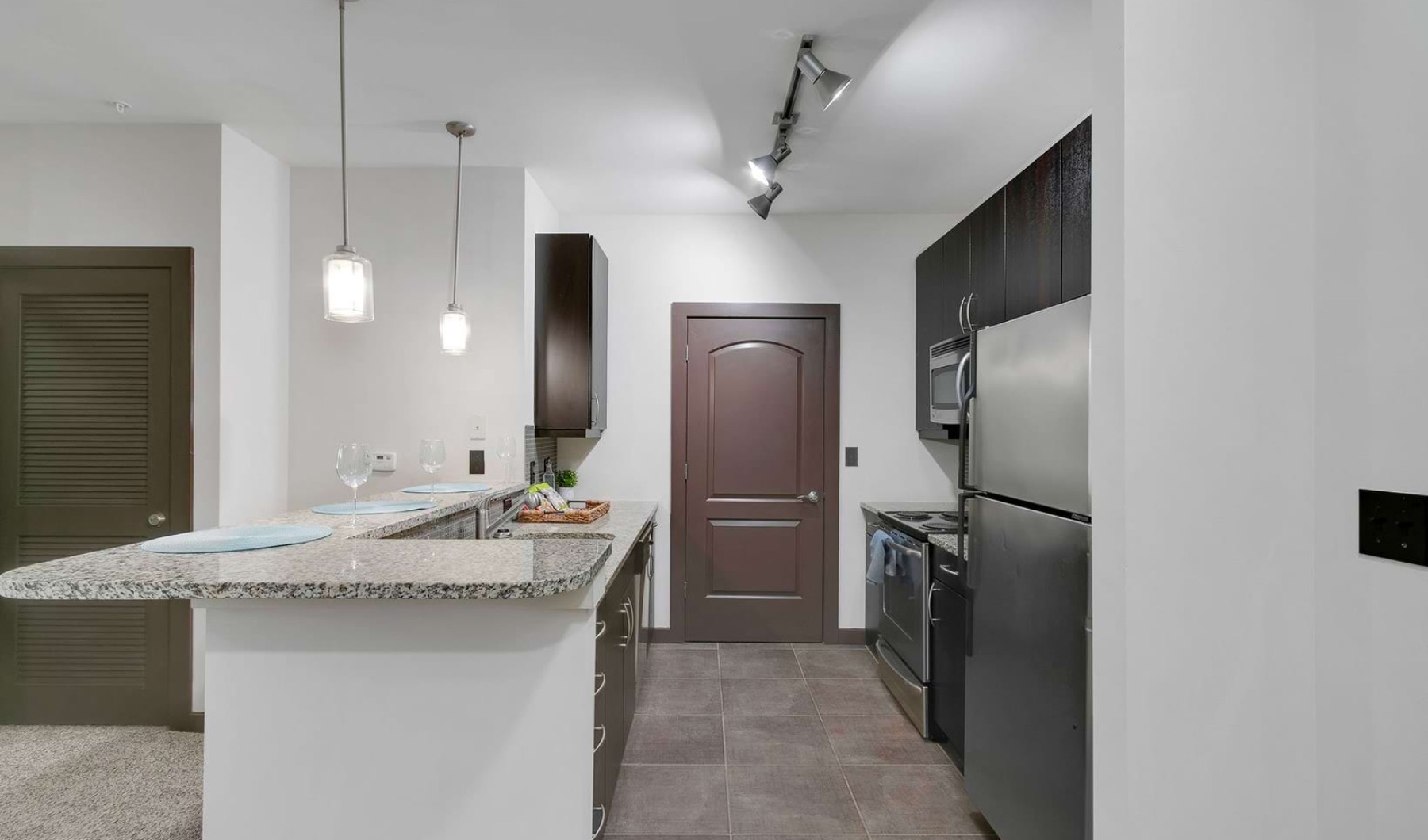 pendant lights over open kitchen counter top