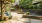 a courtyard with a bench and plants